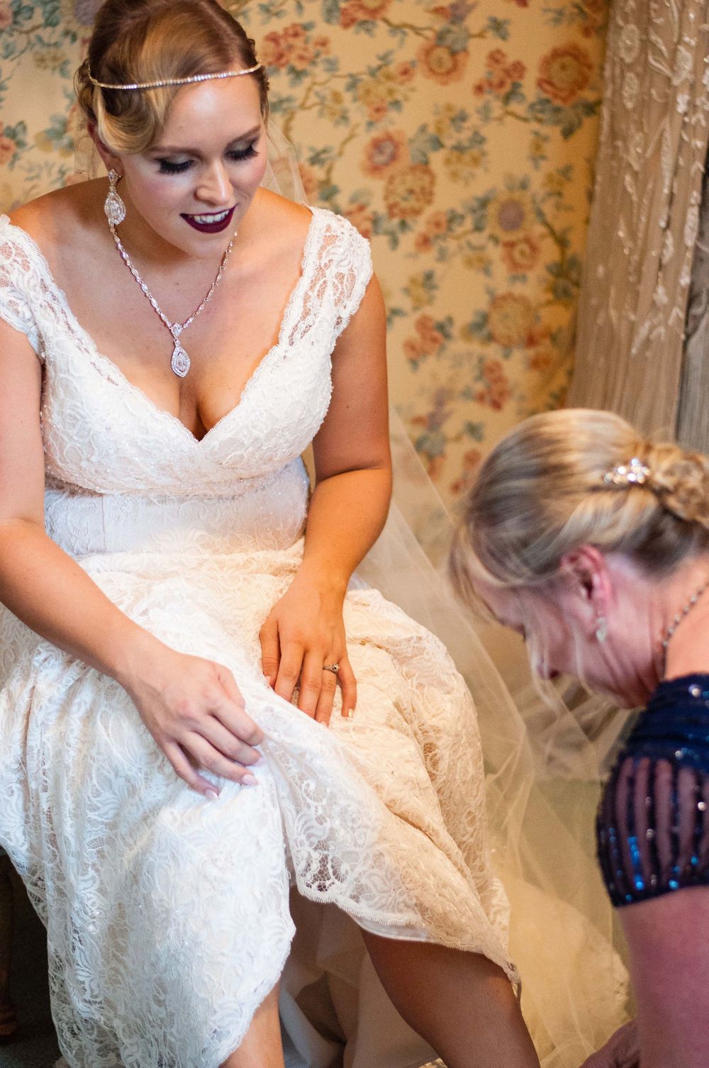bride putting shoes on at Monday Club in San Luis Obispo