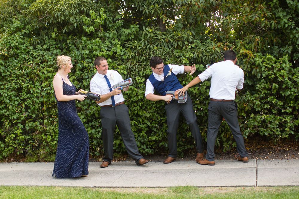 Groom with groomsmen having a nerf gun battle at Monday Club in San Luis Obispo