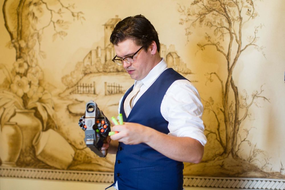 groom reloading nerf gun at Monday Club in San Luis Obispo