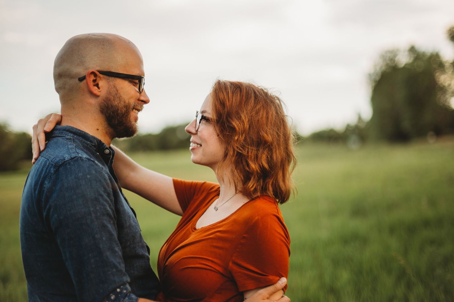 A couple walks along the path at Ross Natural Area during their portrait session in Fort Collins, Colorado.