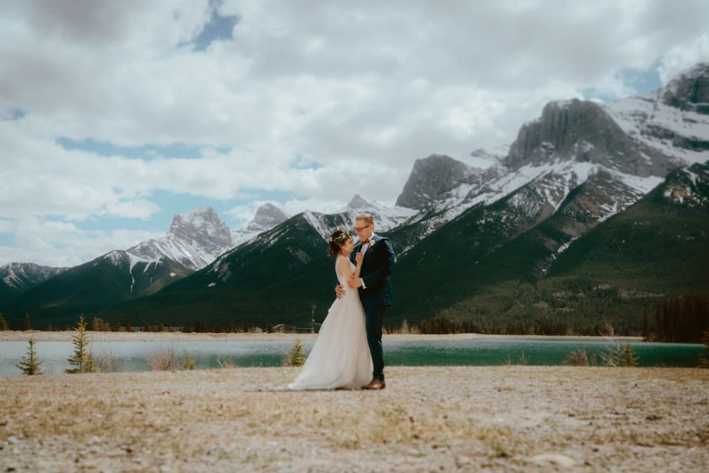 Wedding ceremony with scenic mountain backdrop at sunset in Banff National Park.