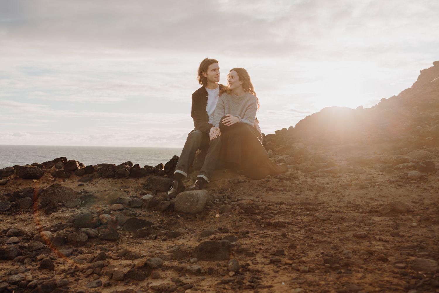 Lovers and sunset for their engagement shoot in Piha with Apertured Media-Auckland Wedding and Elopement Photographer