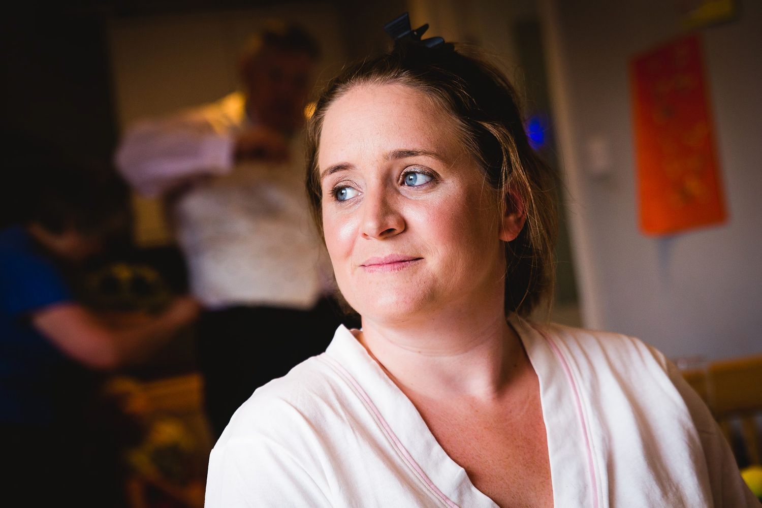 Bride looking into distance while at bridal prep