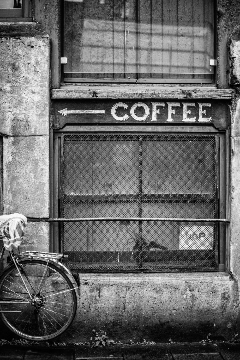 Coffee signage with arrow on a London side street