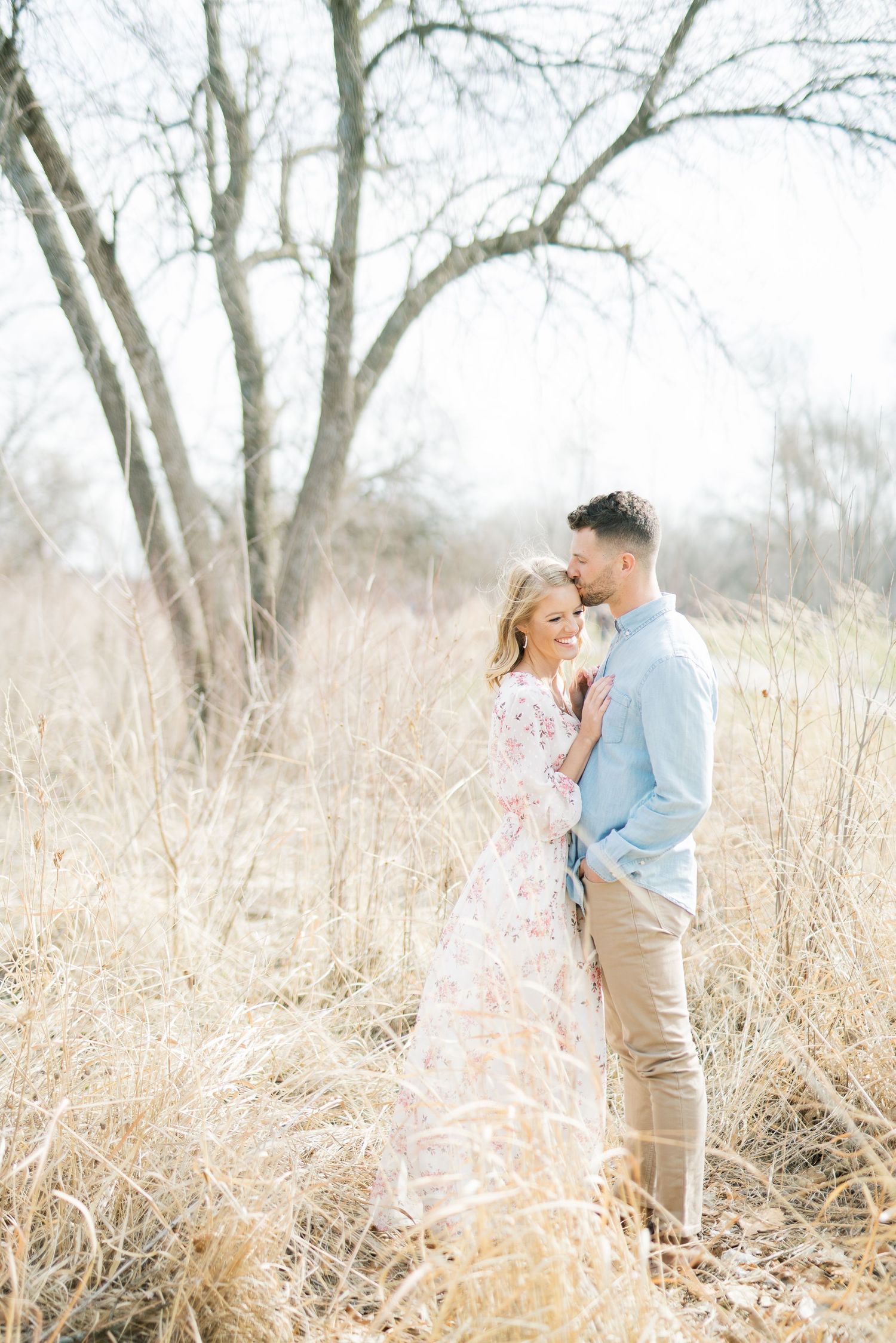 Light and airy film lakeside dock engagement session at Gray's Lake in Des Moines, Iowa