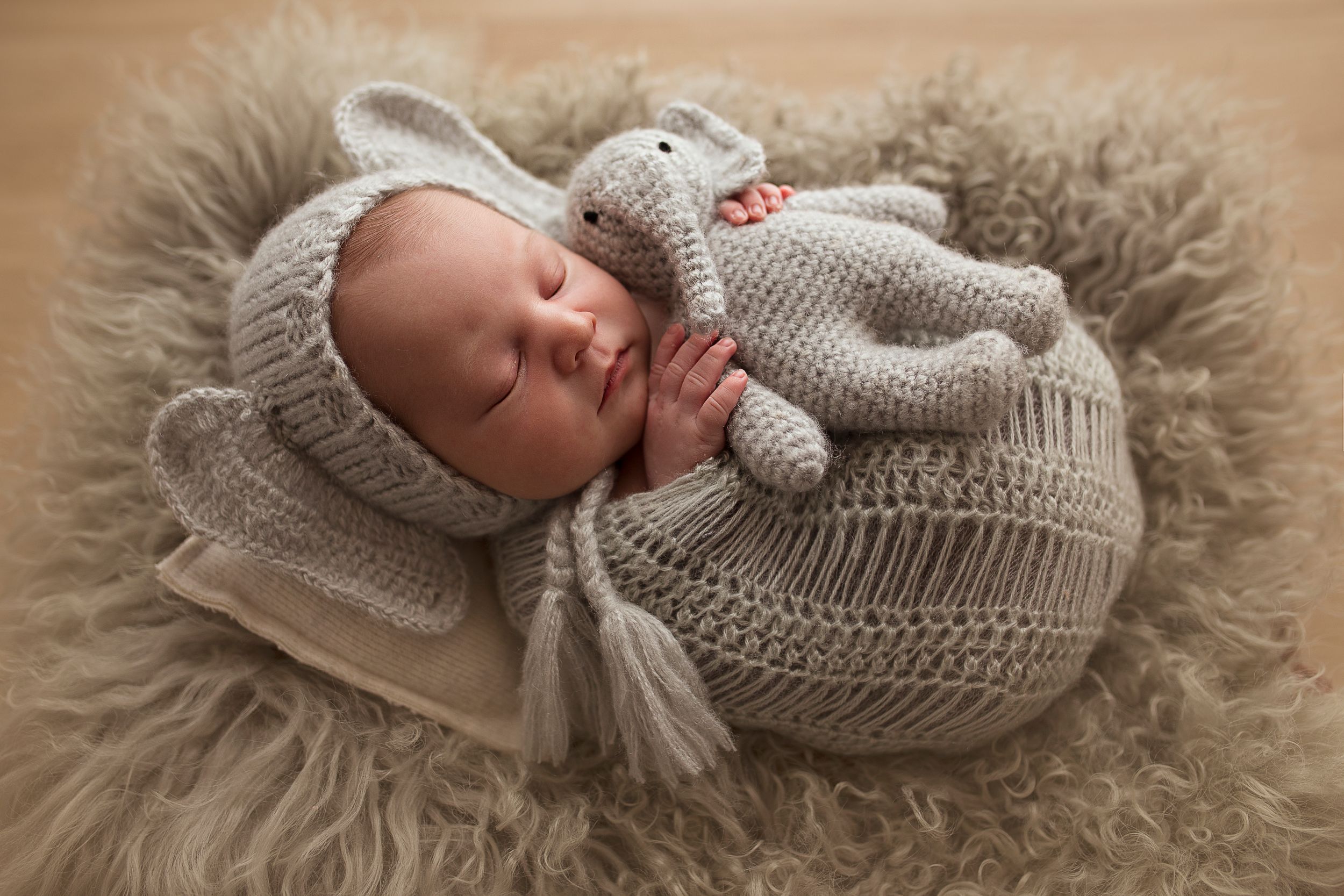 baby boy in elephant suit newborn child sleeping