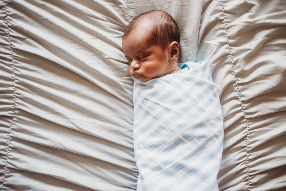 snuggled baby by boston newborn photographer