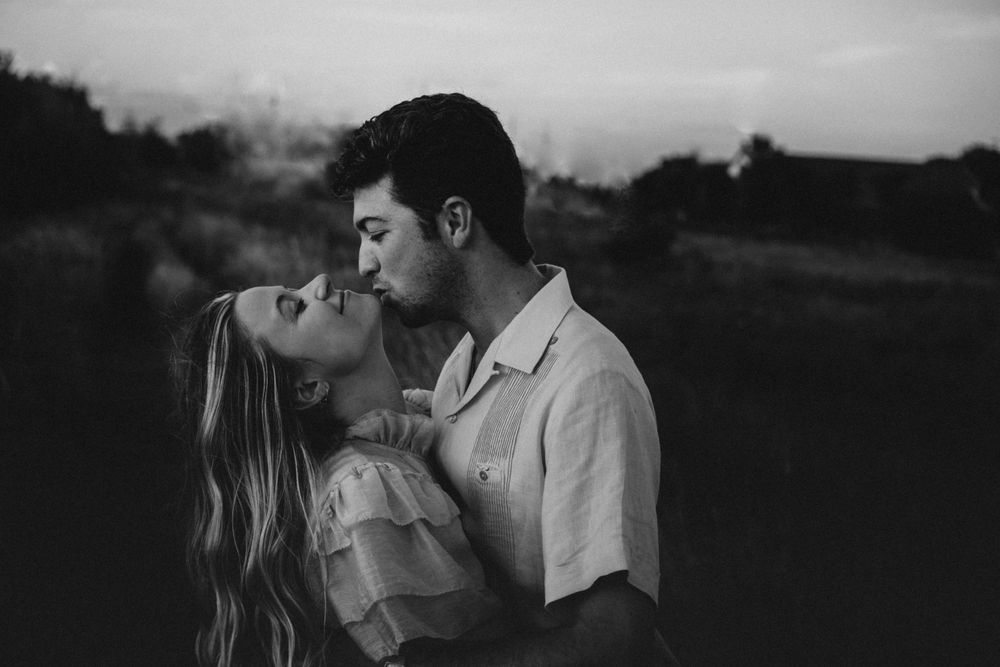 Couple kissing, black and white photo