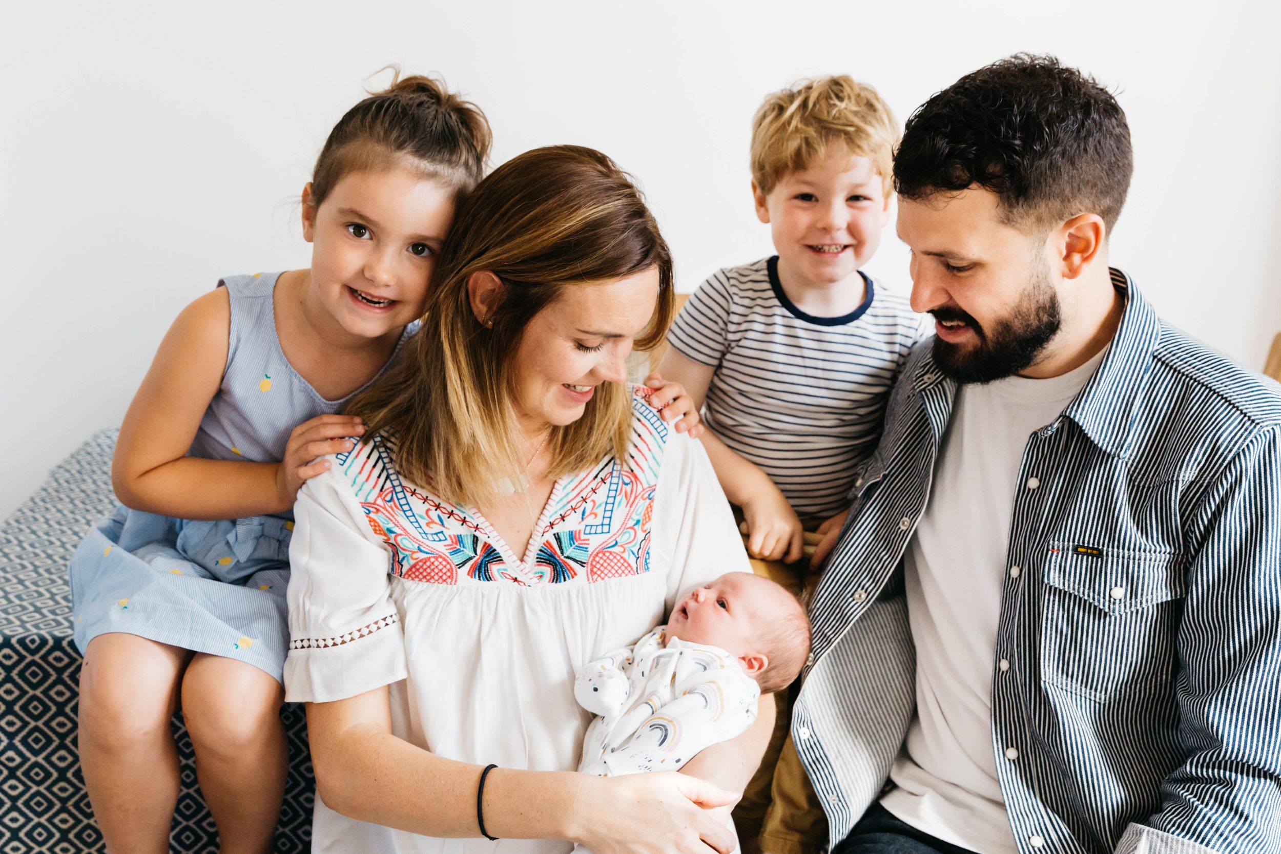 family of five with newborn baby girl