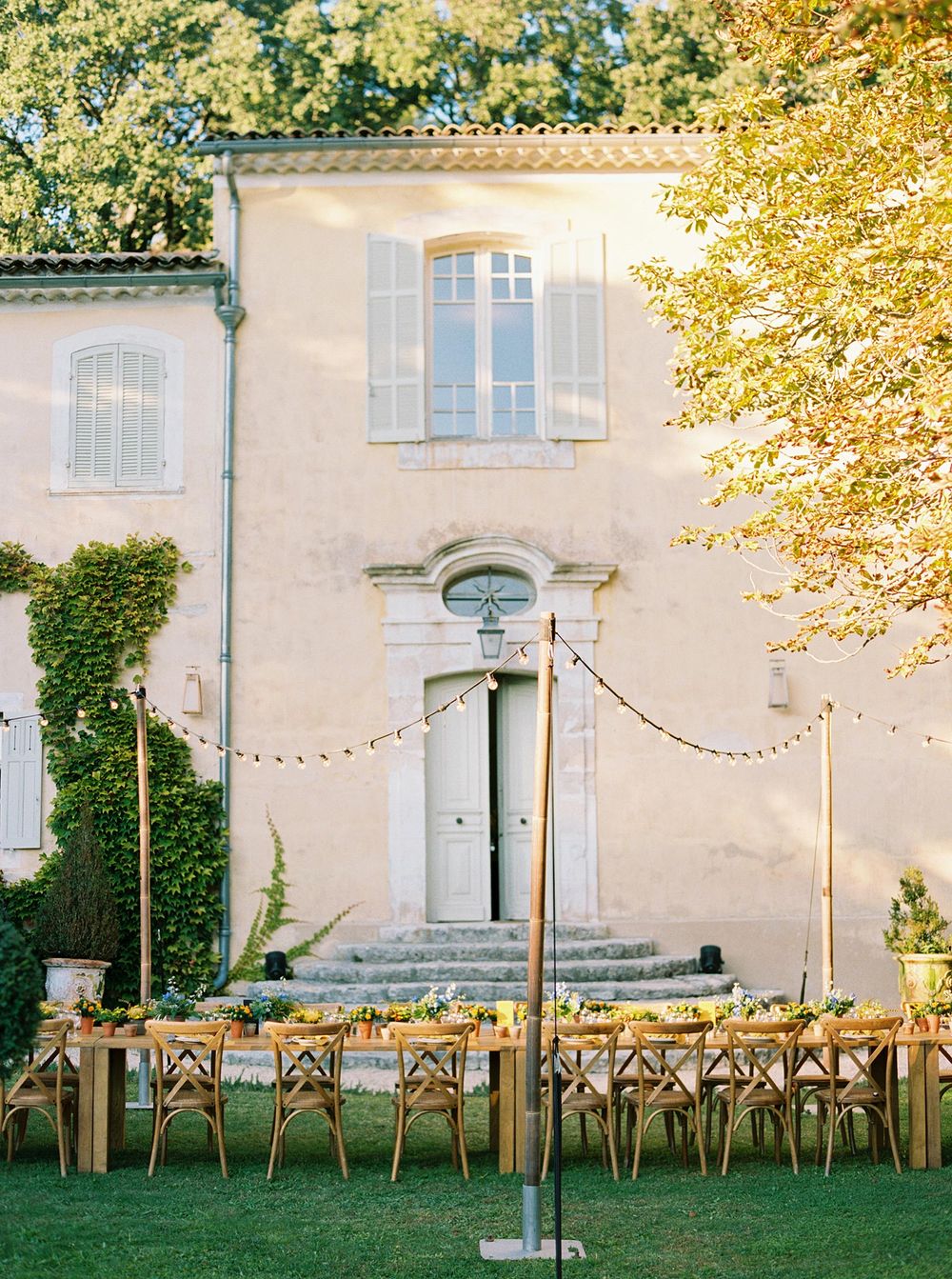 Scenic outdoor dining area at La Bastide de Ganay, Provence, with tables and chairs.