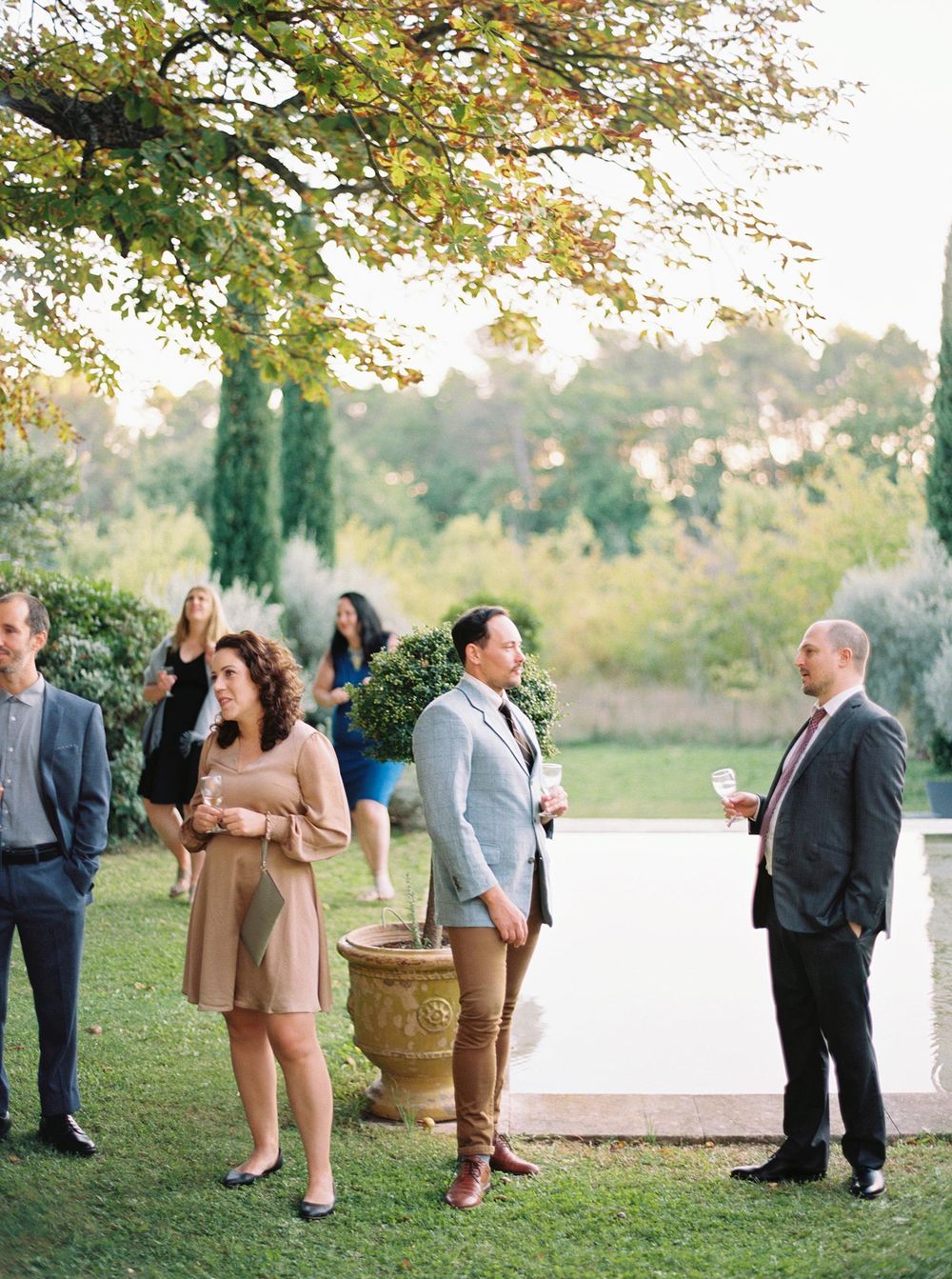Guests at La Bastide de Ganay, Provence, socializing around a pool.