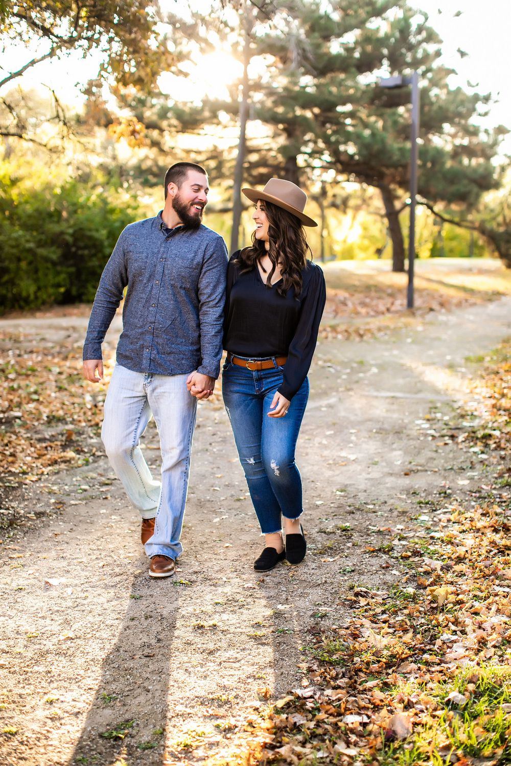 Couple walking down a path a sunset during a family photography session in Minneapolis, MN