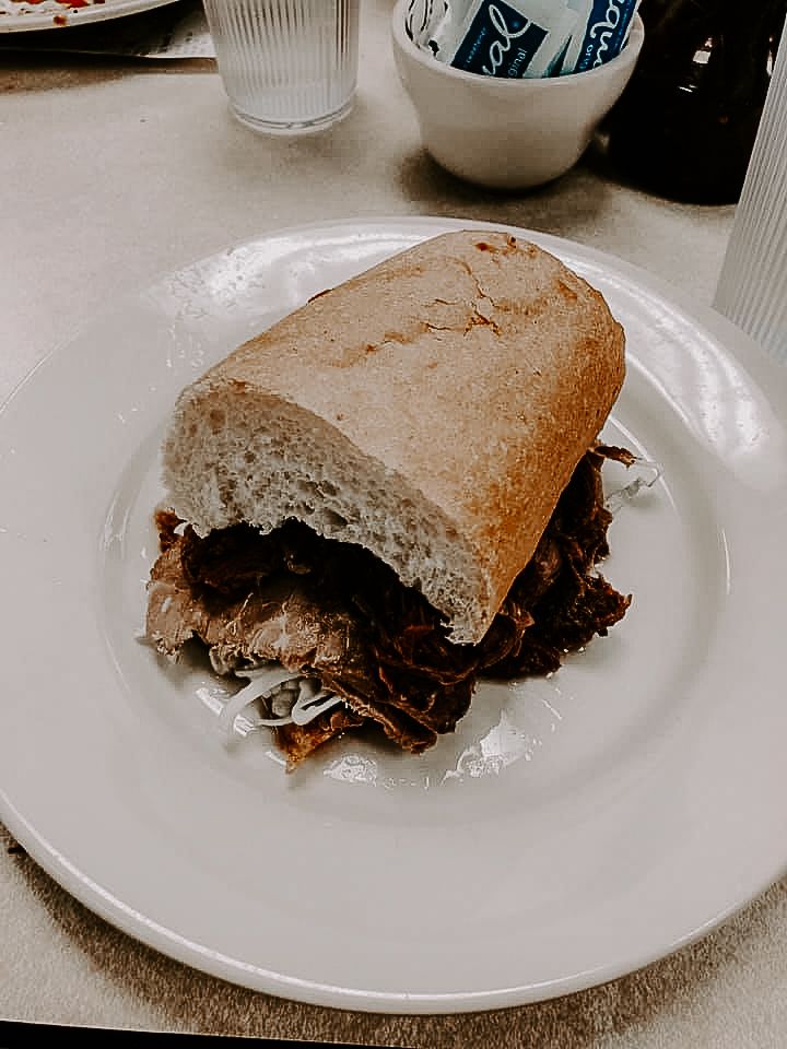 sandwich from Mulate's during an urban elopement in New Orleans