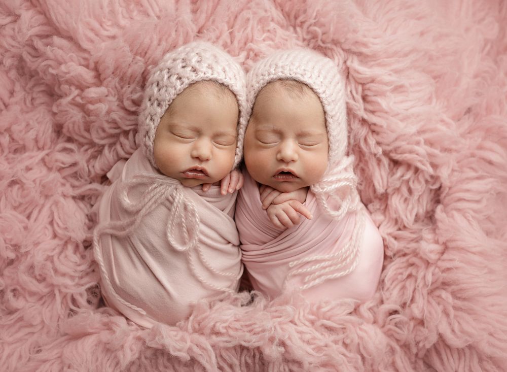 austin newborn photographer Newborn Twins Session baby girls photographed on pink by Austin Newborn Photography