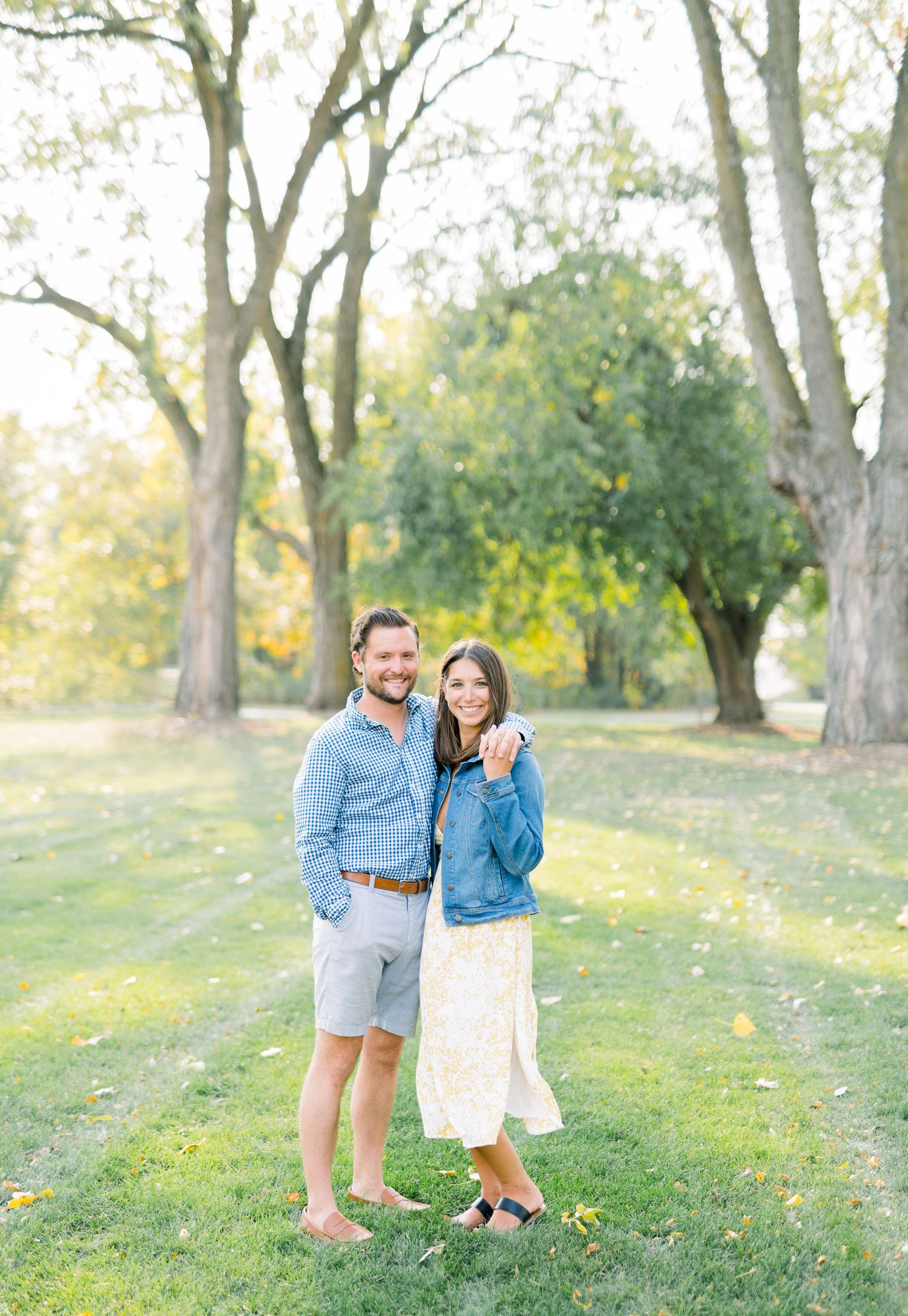 Des Moines Engagement photos at Grays Lake in downtown Des Moines, Iowa with light and airy photographer Nicole Laing