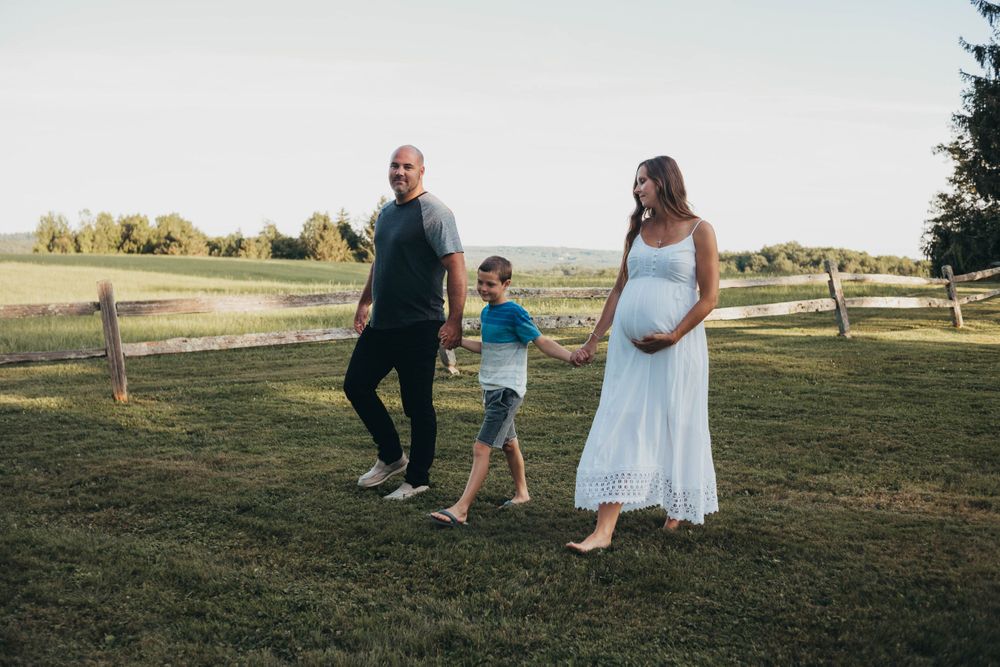 family walking by worcester ma maternity and newborn photographer