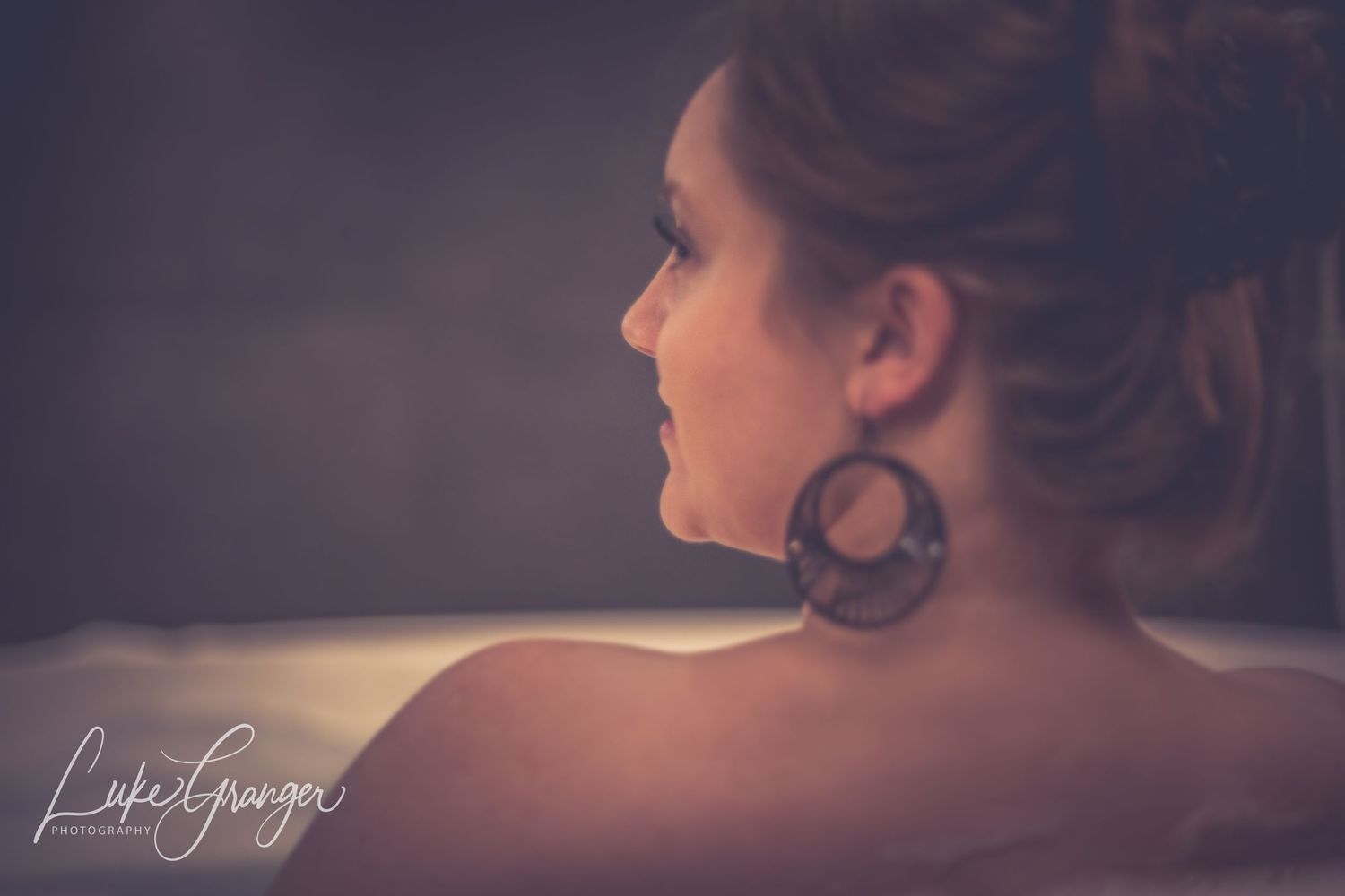 boudoir photo woman looking in the distance in profile