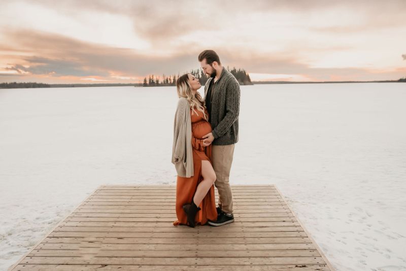 Couple Maternity Photos in front of Lake