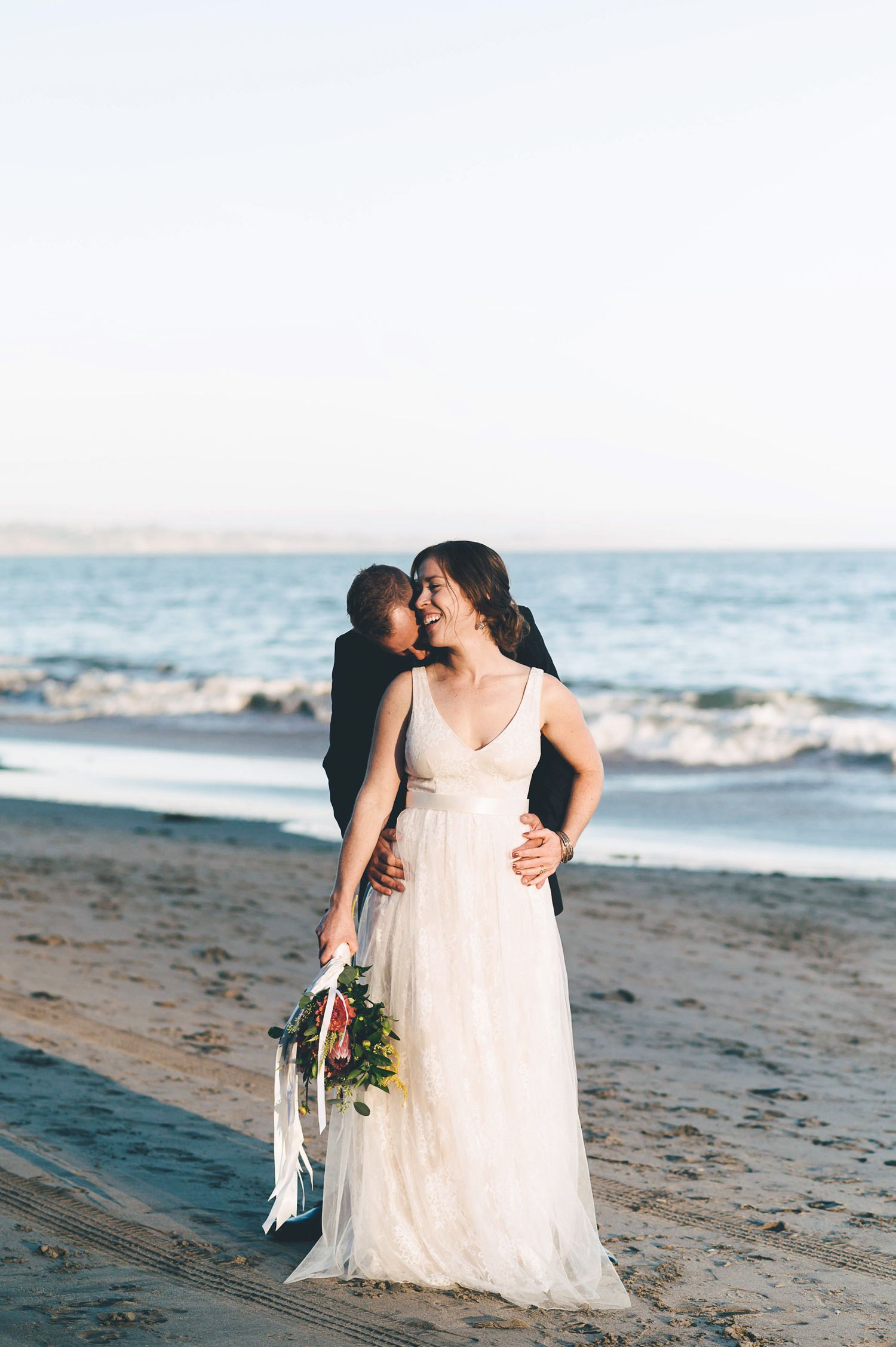 Bride and groom on the beach in Santa Cruz at sunset