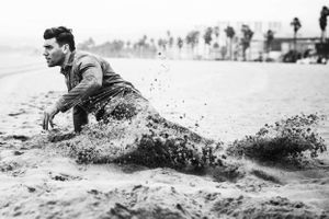 Actor Christian James Levi's Denim Trucker Jacket Jeans Sand Venice Beach Overcast