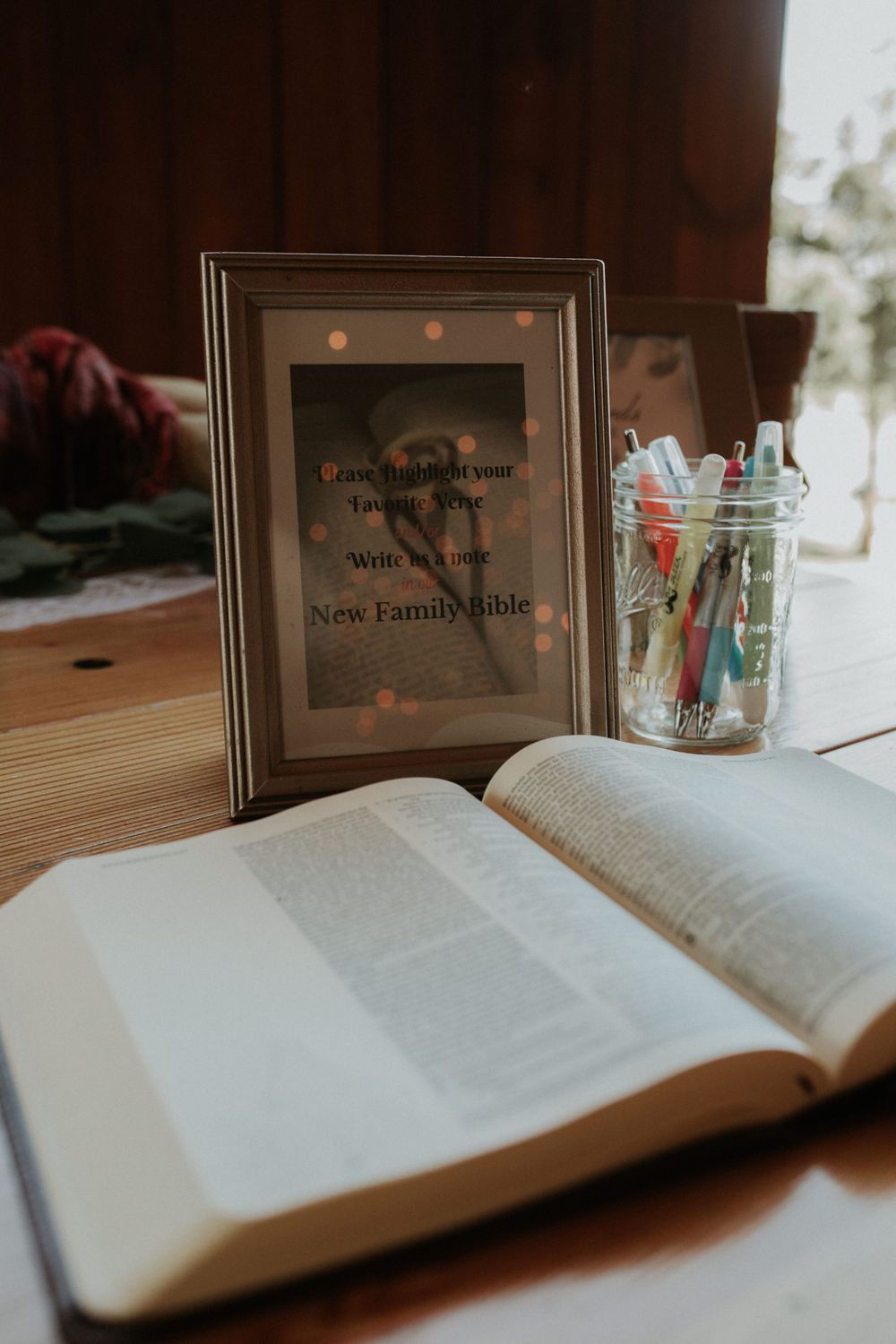 a bible for the guests to highlight Wedding table decoration at a wedding at climbing Bines – Craft Ale & Hop Farm
