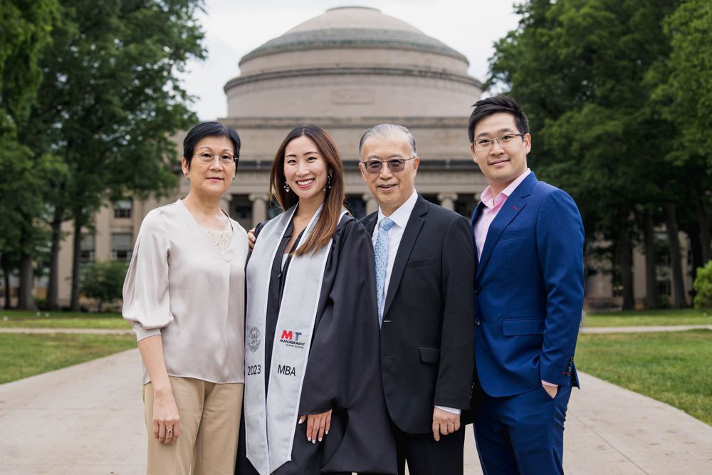 Group photo in front of MIT's Great Dome during graduation.