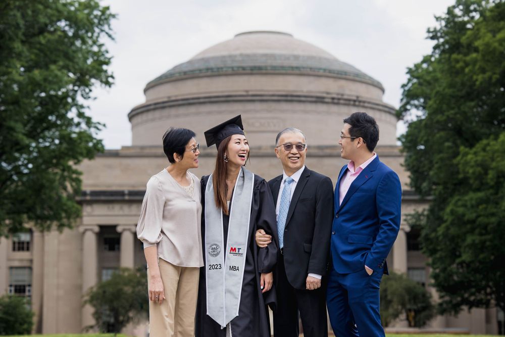 Family graduation portrait with the MIT dome building in the background.