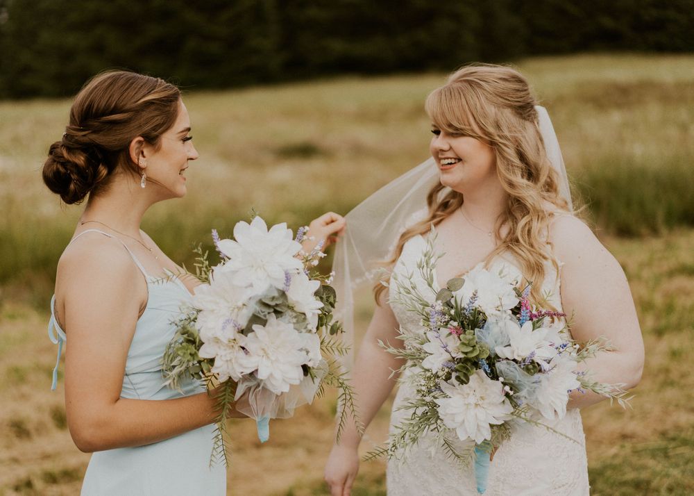 Photo by Kelsie Burke Photography of the bride with a bridesmaid