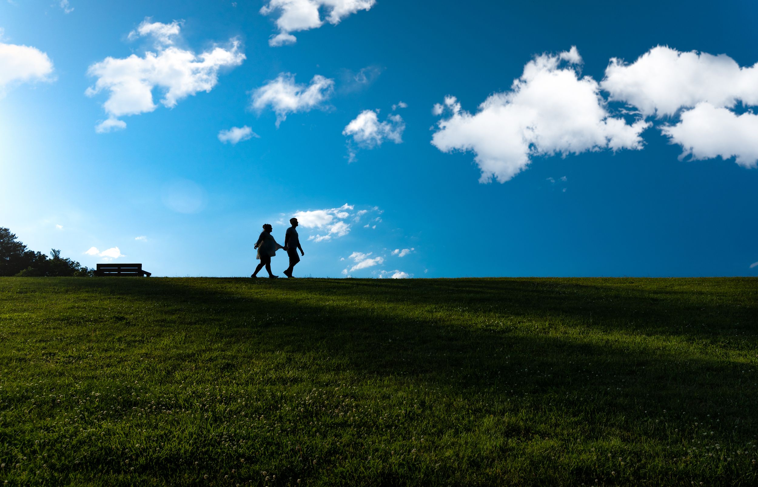 engaged couple walking on a hillside at sweet arrow lake Schuylkill county pa