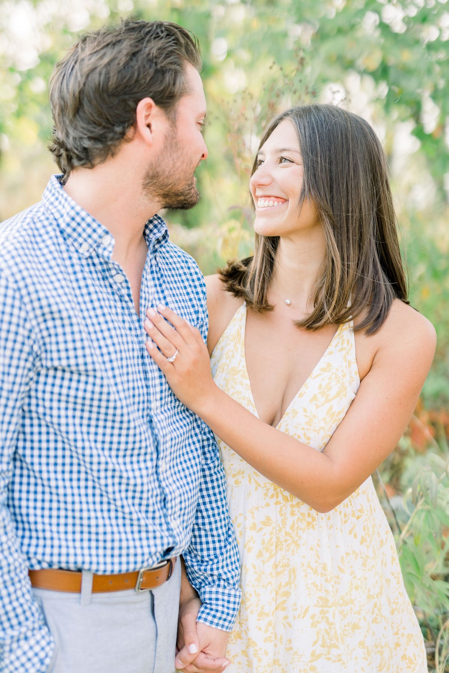 Des Moines Engagement photos at Grays Lake in downtown Des Moines, Iowa with light and airy photographer Nicole Laing