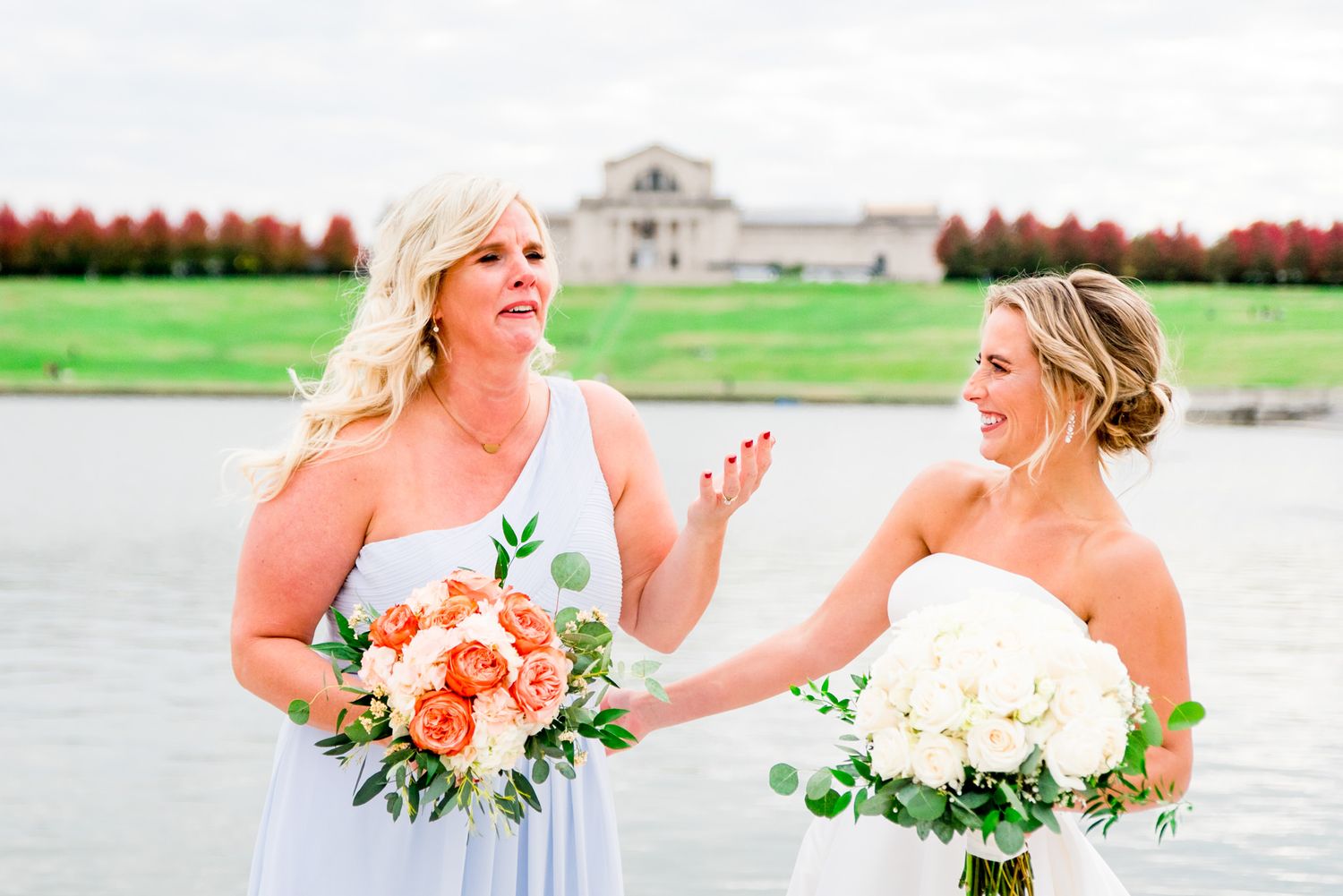 bride laughs and bridesmaid cries at fall wedding in Forest Park, STL