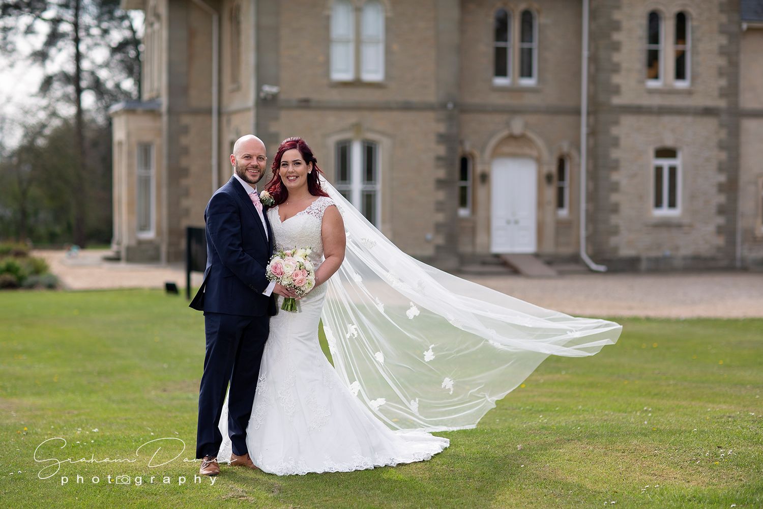 bride and groom on the grounds of beautiful St Tewdrics House