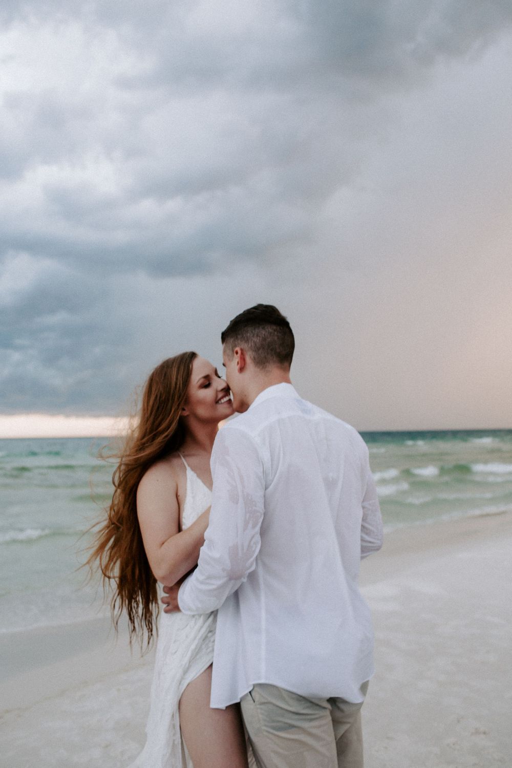 woman smiling as she goes in for a kiss to her new husband during their Florida elopement