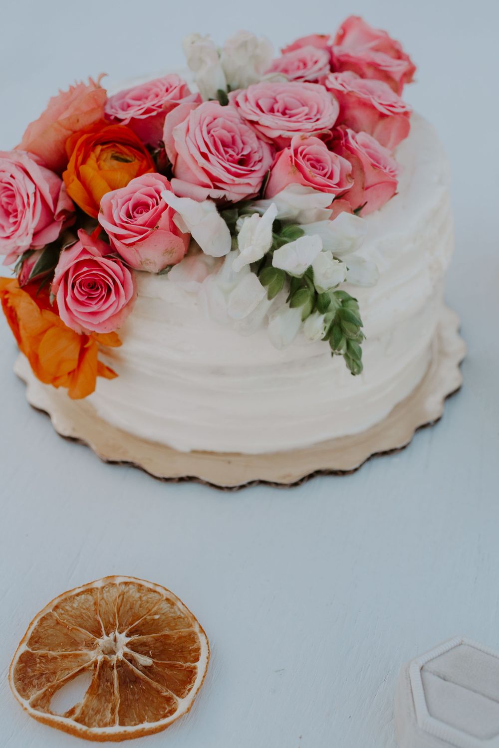 Citrus themed cake for a beachside elopement