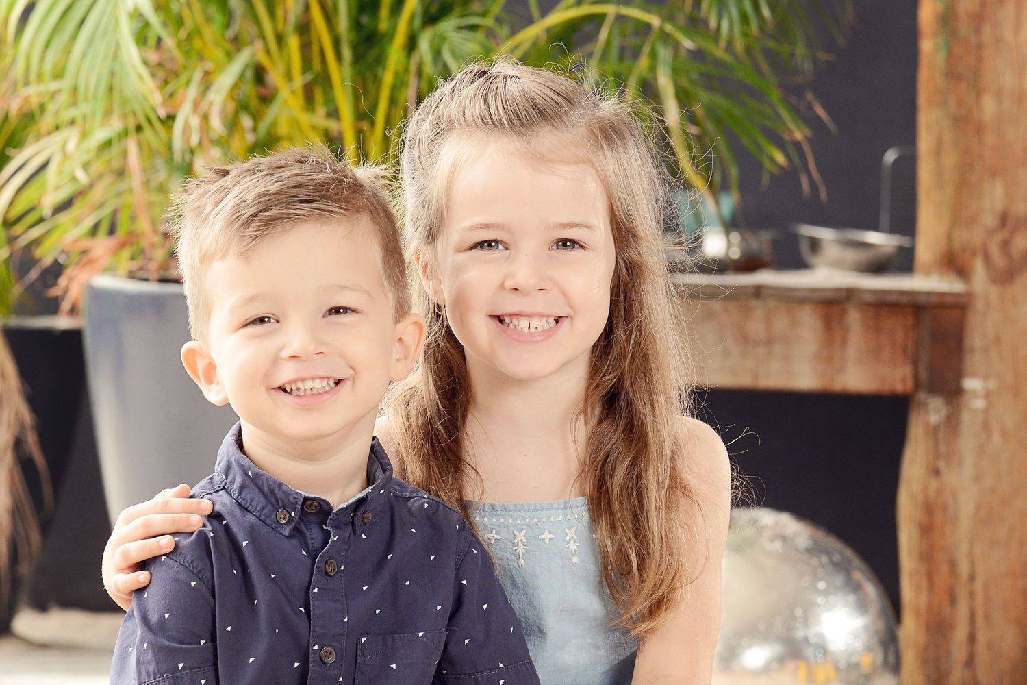 Brother and sister smile for kindy photo