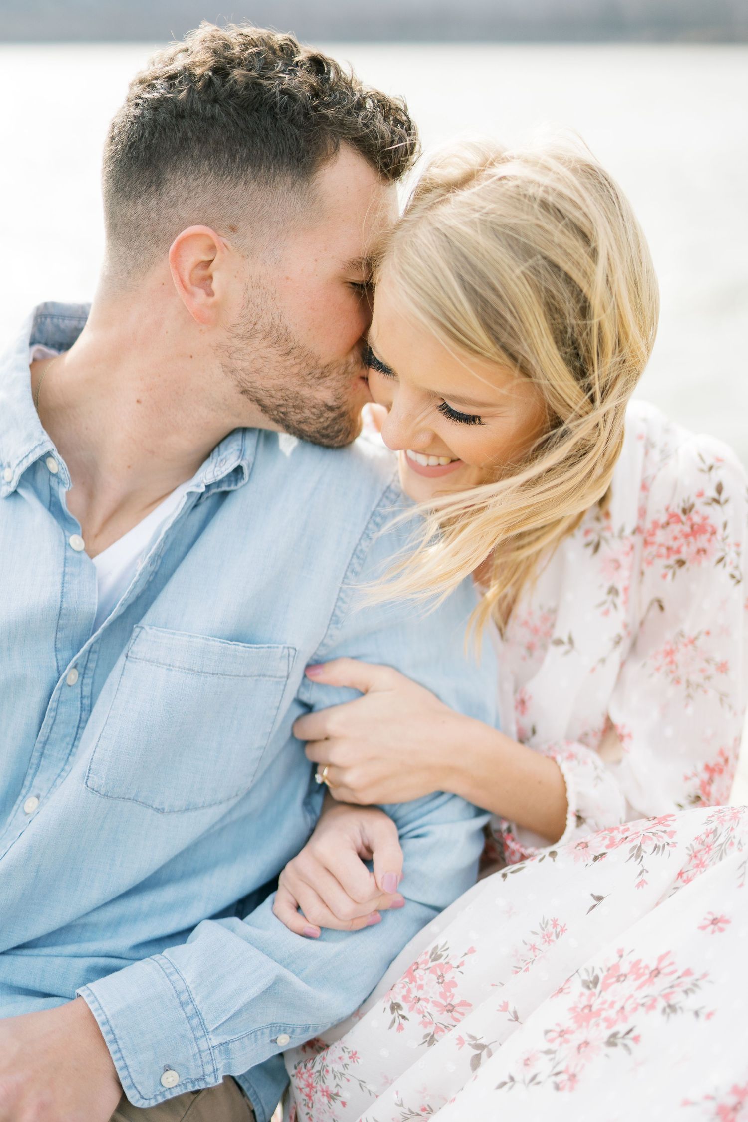 Light and airy film lakeside dock engagement session at Gray's Lake in Des Moines, Iowa