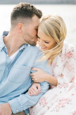 Light and airy film lakeside dock engagement session at Gray's Lake in Des Moines, Iowa