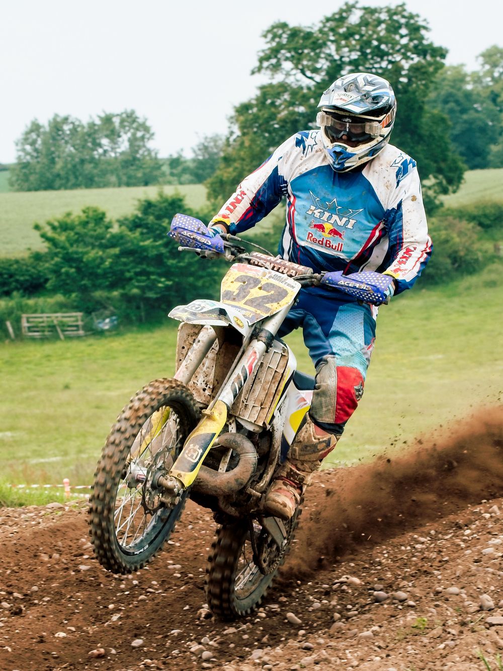 motorcross rider landing after a jump front wheel off the ground