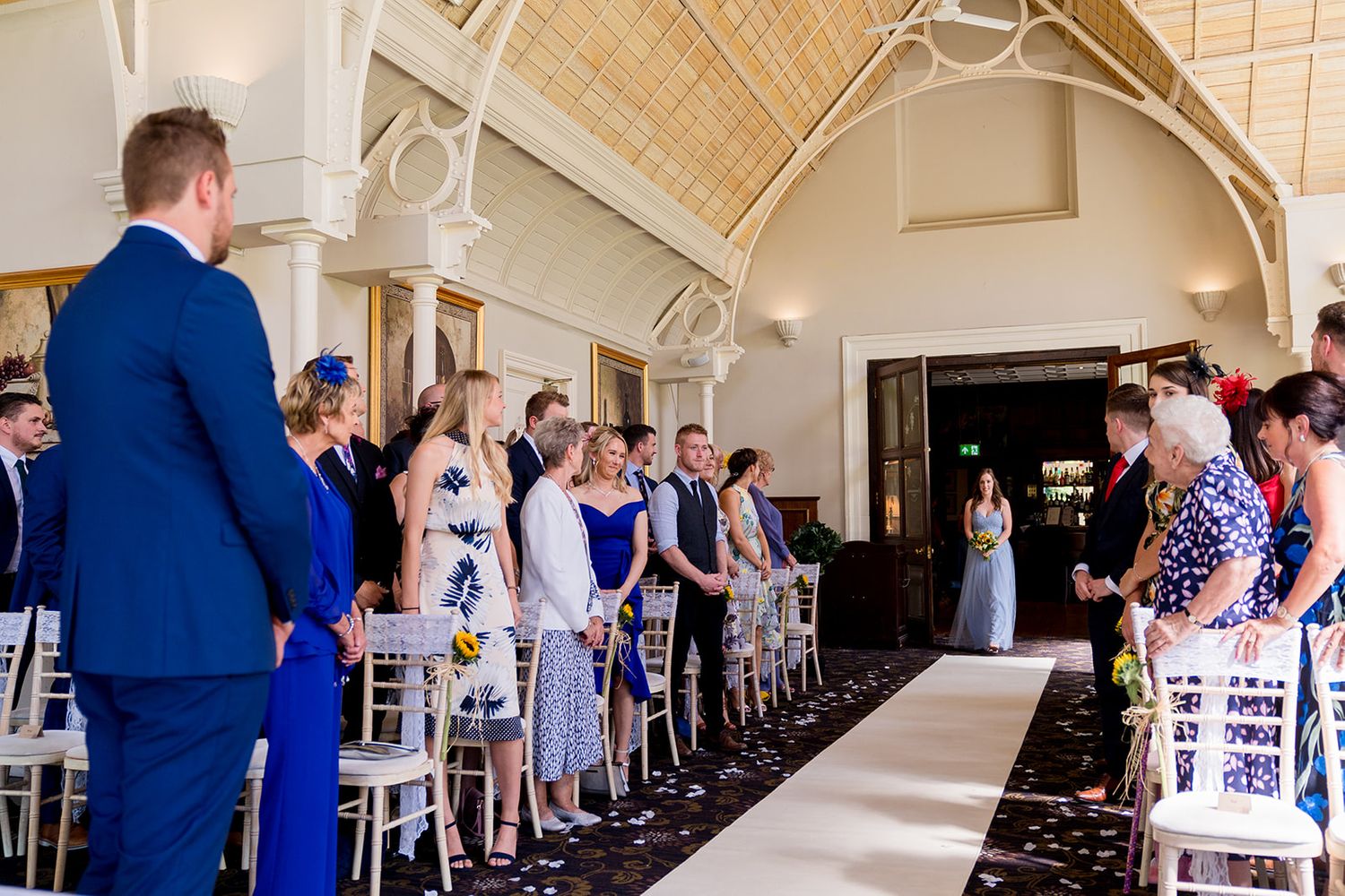 Bridesmaid walking down aisle