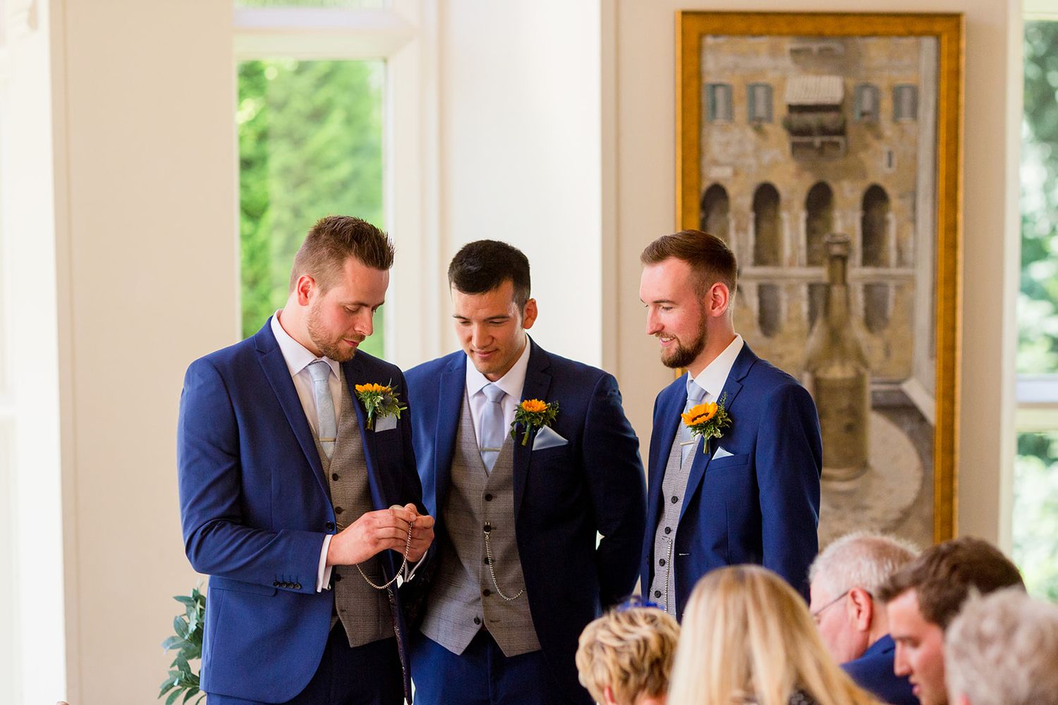 Groom and groomsmen blue suit ceremony
