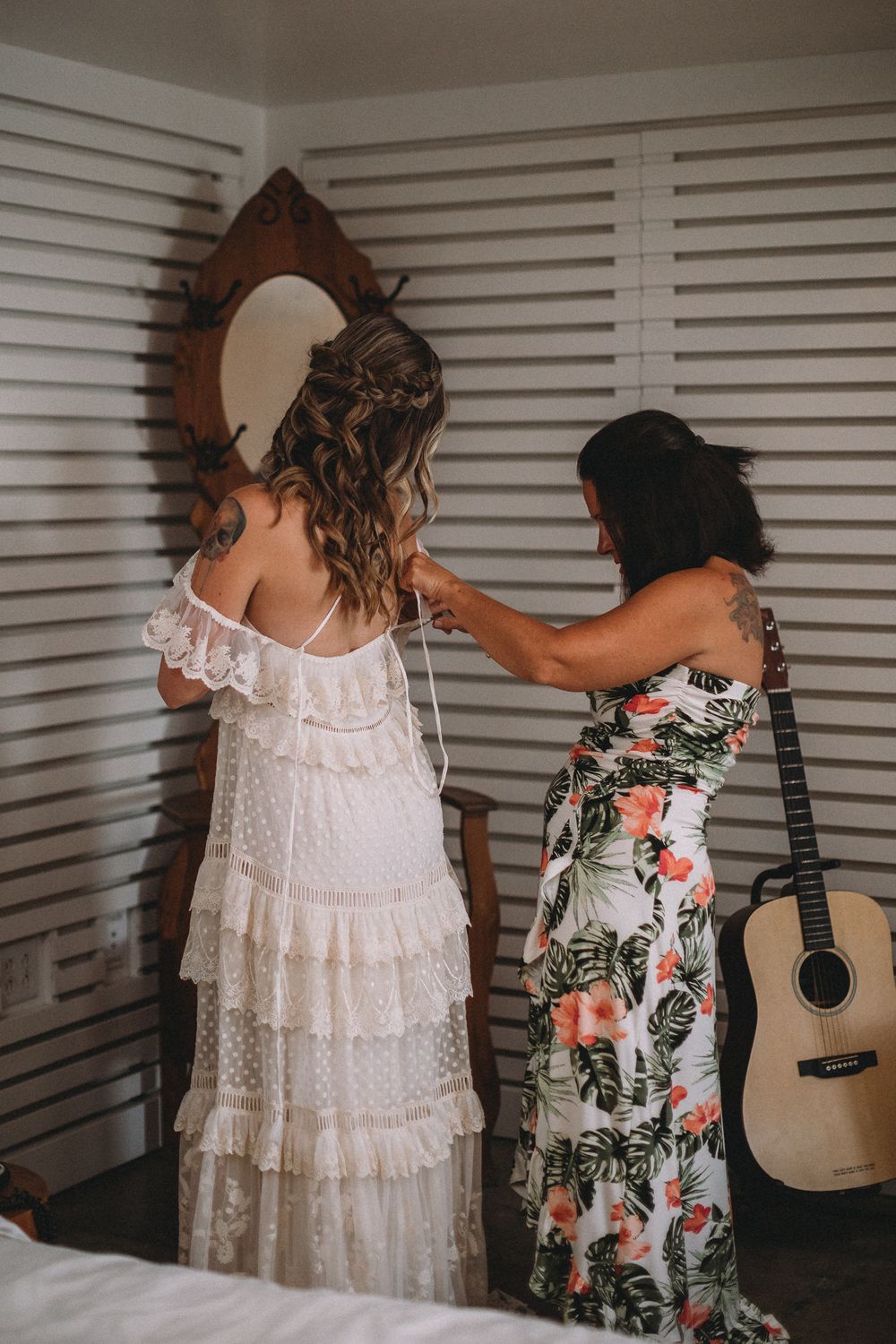 Mother of the bride helping her daughter with the final touches before she walks down the aisle
