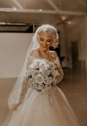 bride with book bouquet photos