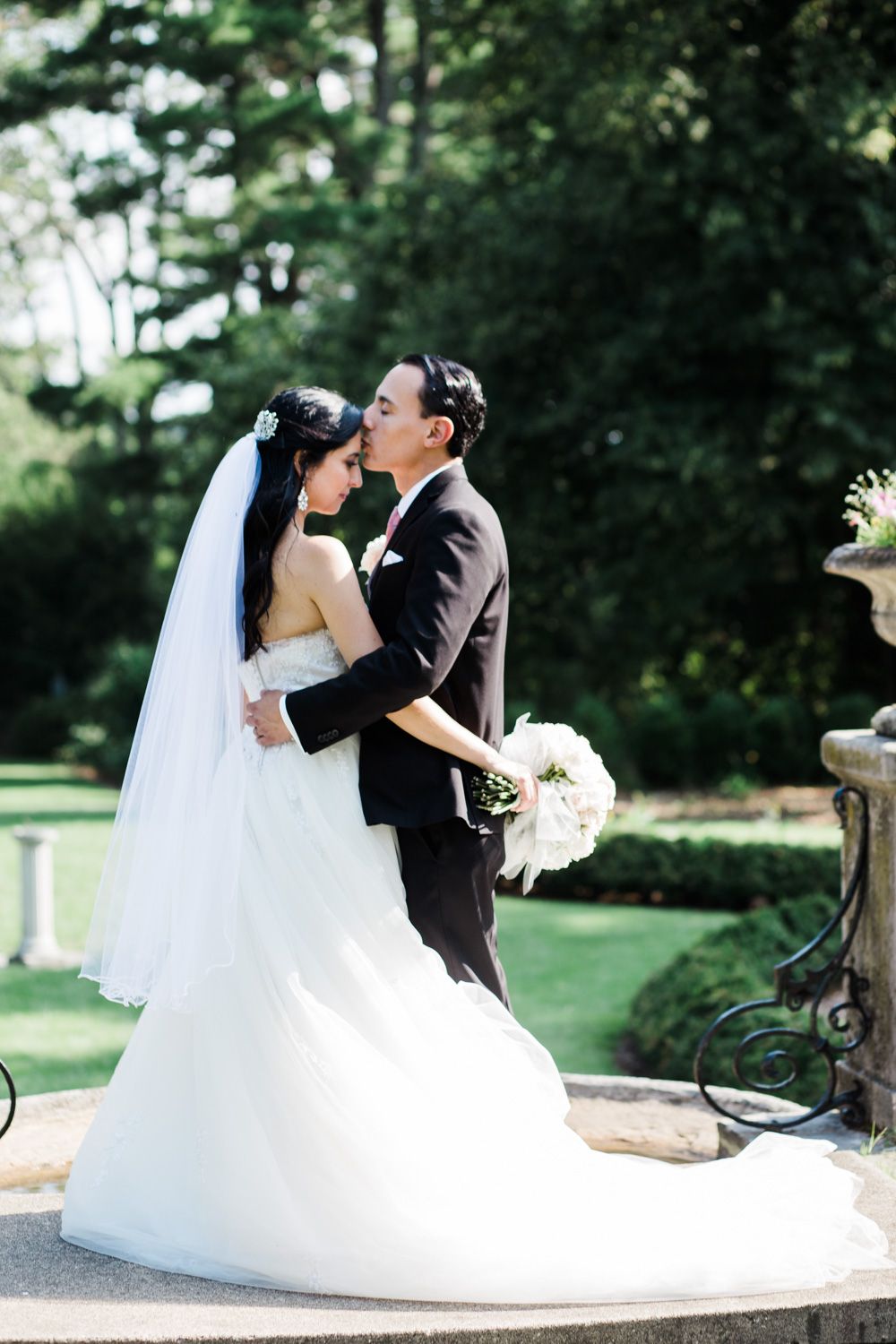 Bride and groom share a quiet moment at the New Jersey Botanical Garden