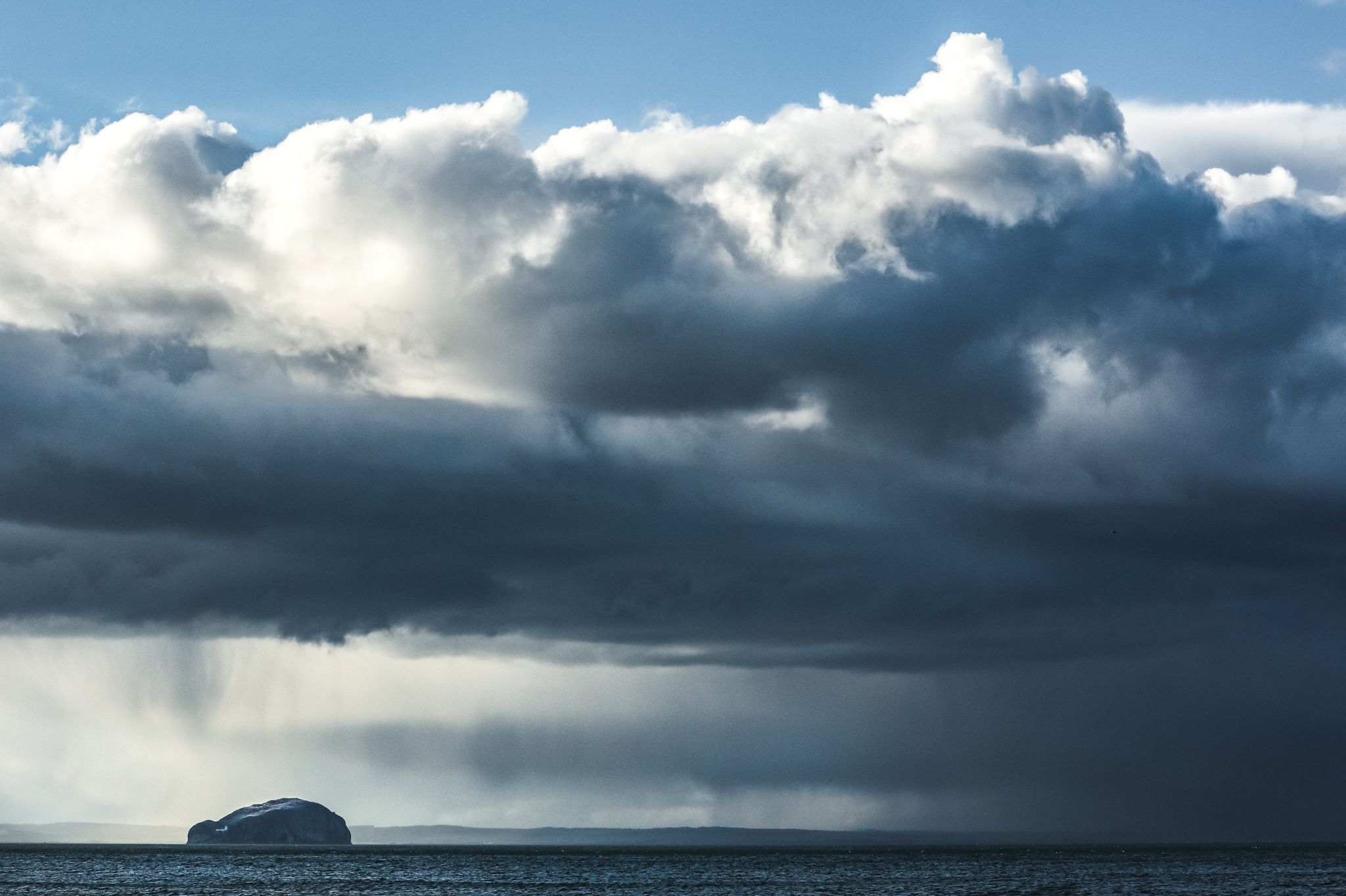 The Bass Rock on the Firth of Forth from Belhaven Bay East Lothian Edinburgh Scotland Landscape dramatic adventure photo