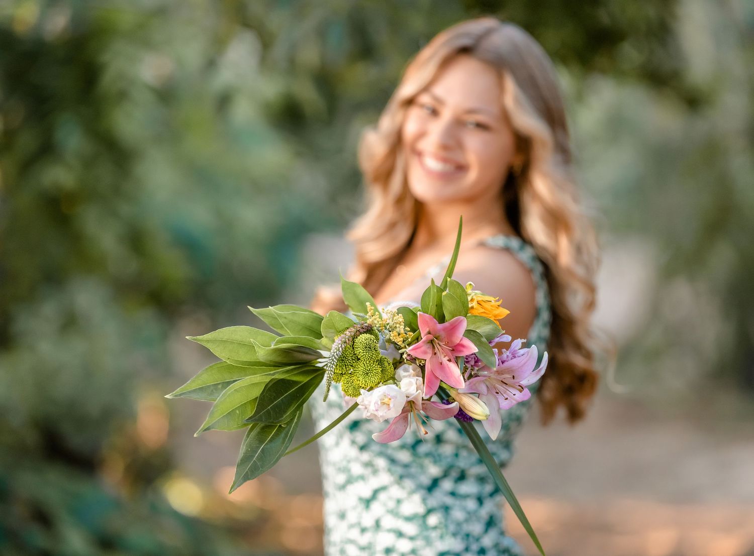 Girl with bouquet in garden