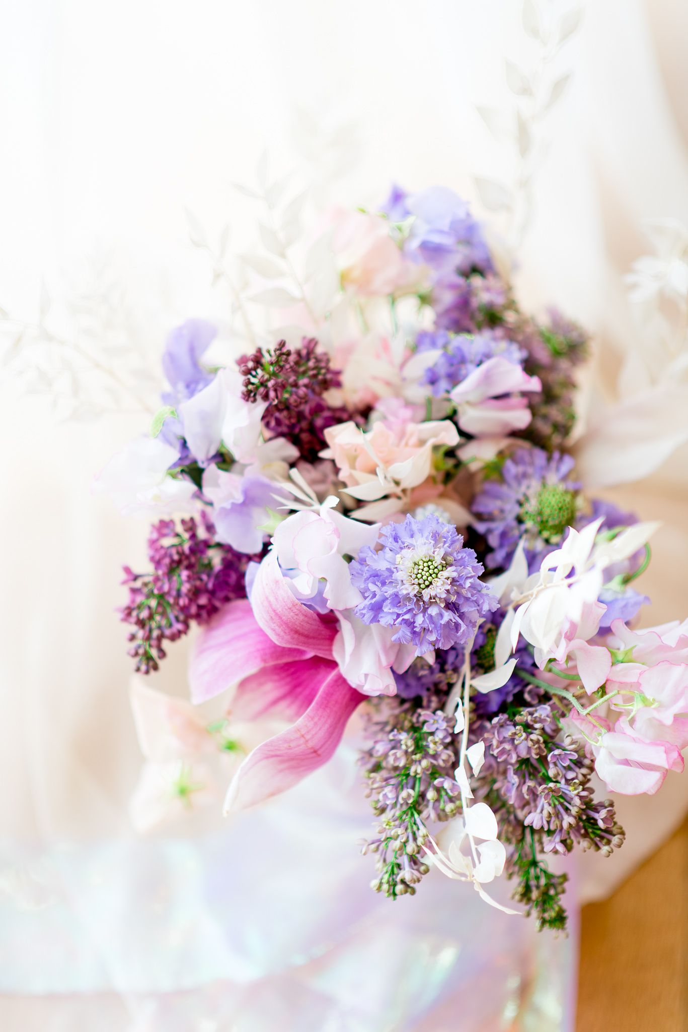 pink and purple bouquet with lilacs by Carly Messmer Floral for a wedding at The Center Cincinnati