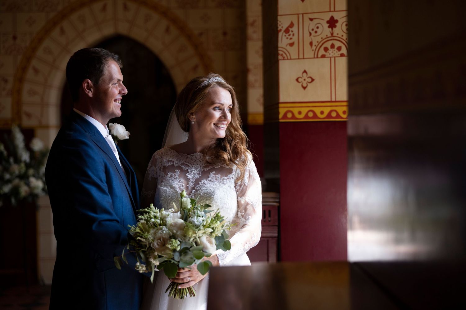 window light and beautiful bride and groom wedding photograph