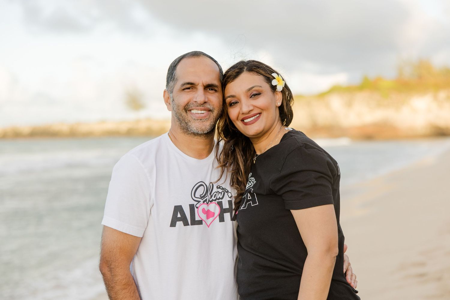 Affordable Maui Photography - Mom and Dad hug and pose for shot during family session