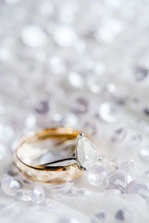 wedding bands stacked on top of each other on sequin wedding dress