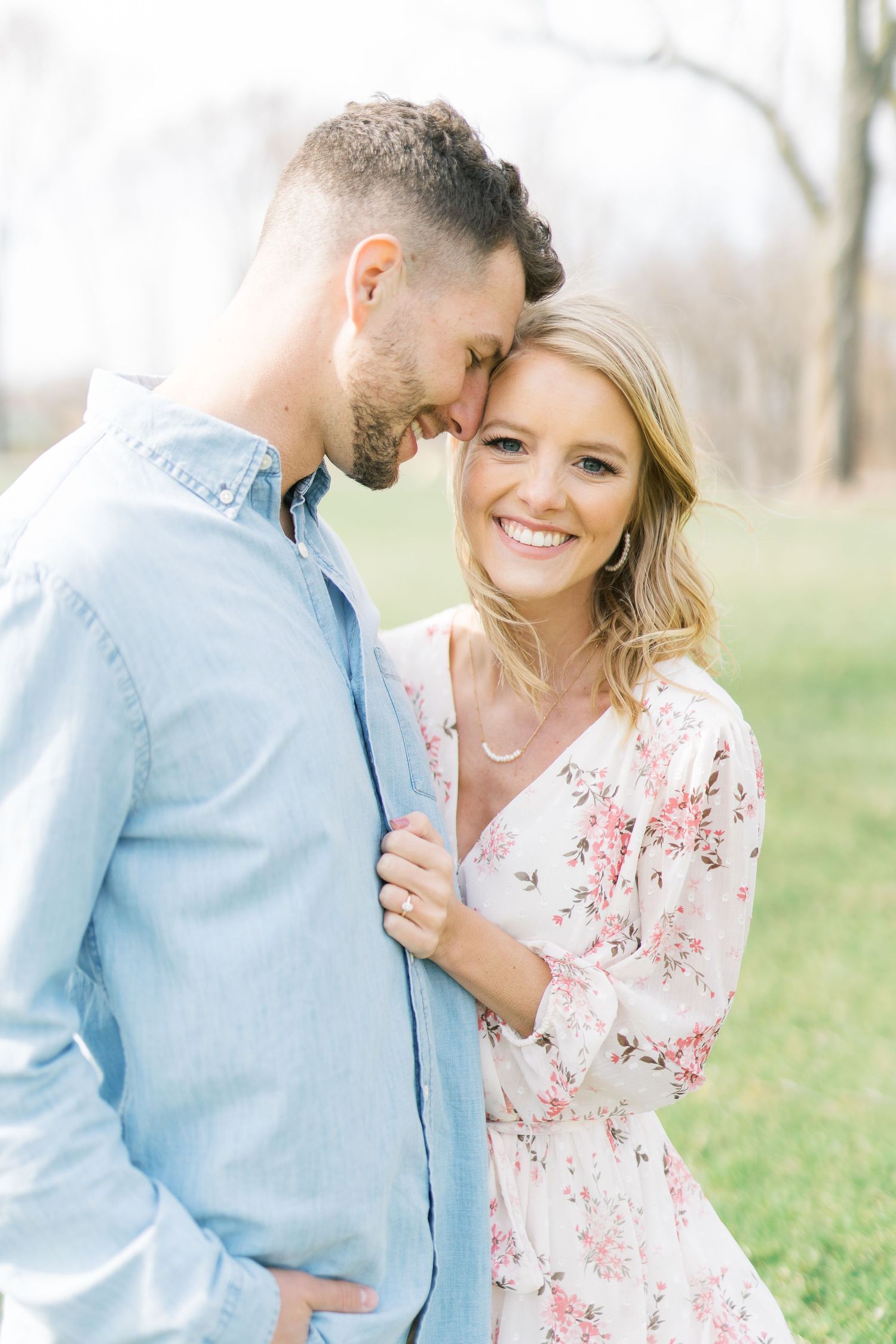 Light and airy film lakeside dock engagement session at Gray's Lake in Des Moines, Iowa